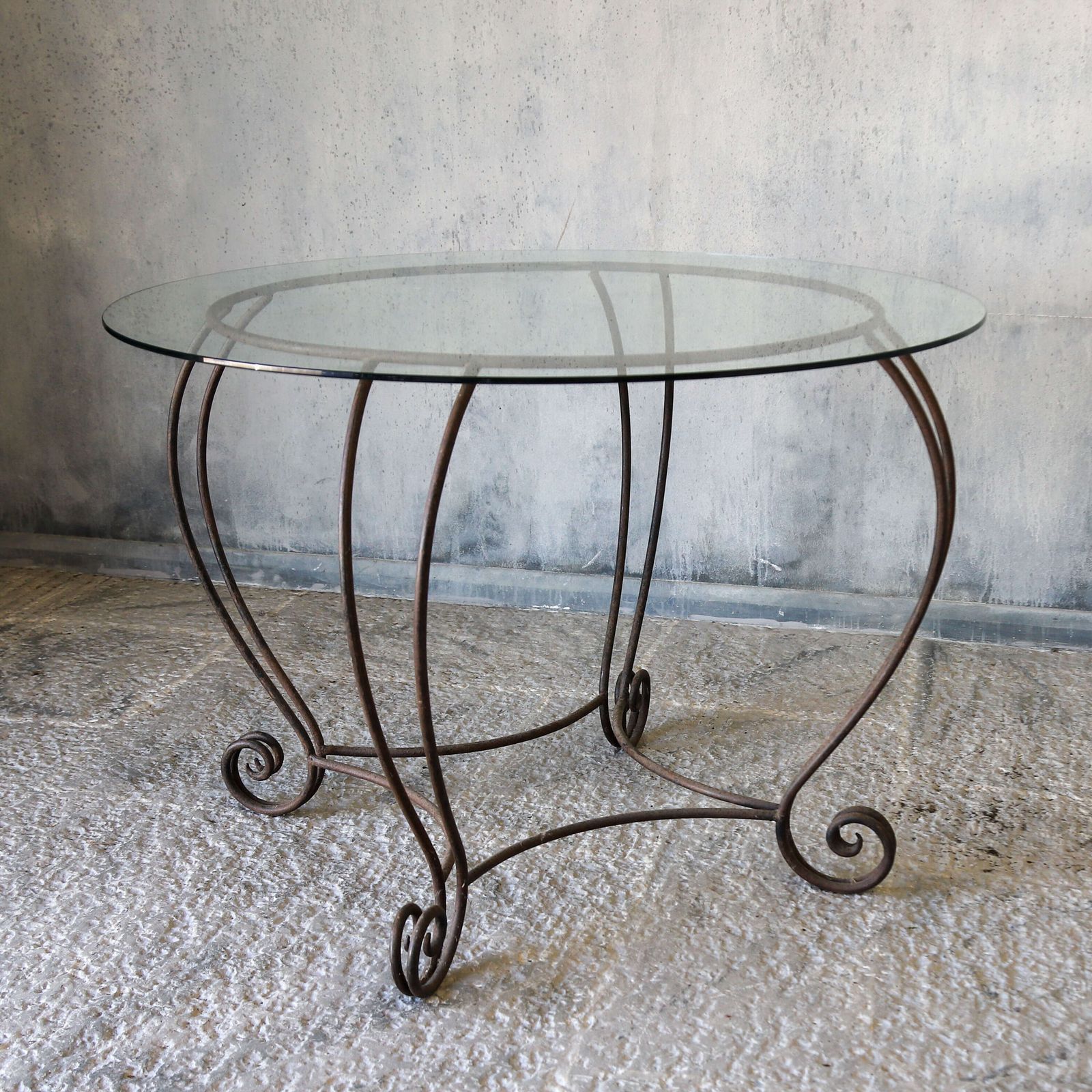 Stylish Mid Century Circular Table With Bevelled Glass Top And Decorative Metal Base photo for sale