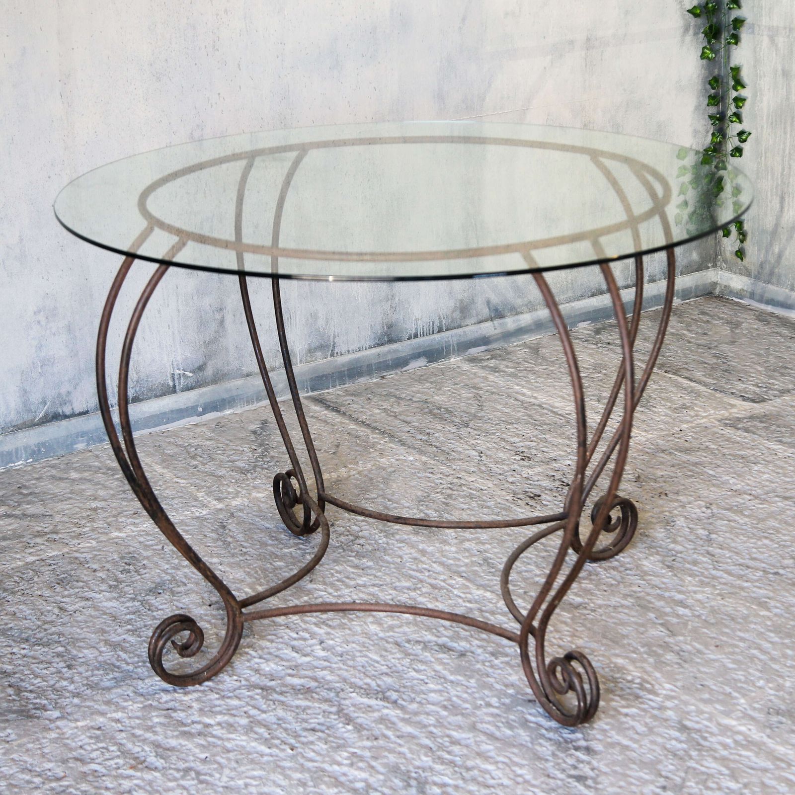 Stylish Mid Century Circular Table With Bevelled Glass Top And Decorative Metal Base photo buy