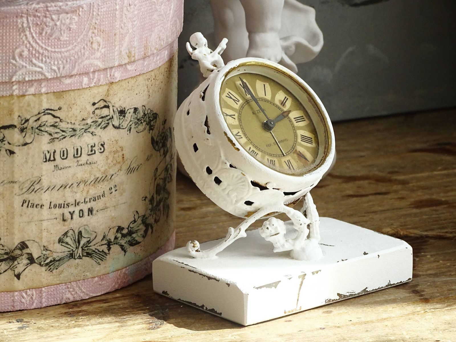 photo furniture White Antique Cherub Table Clock: Tilted Rococo Metal Desk Decor