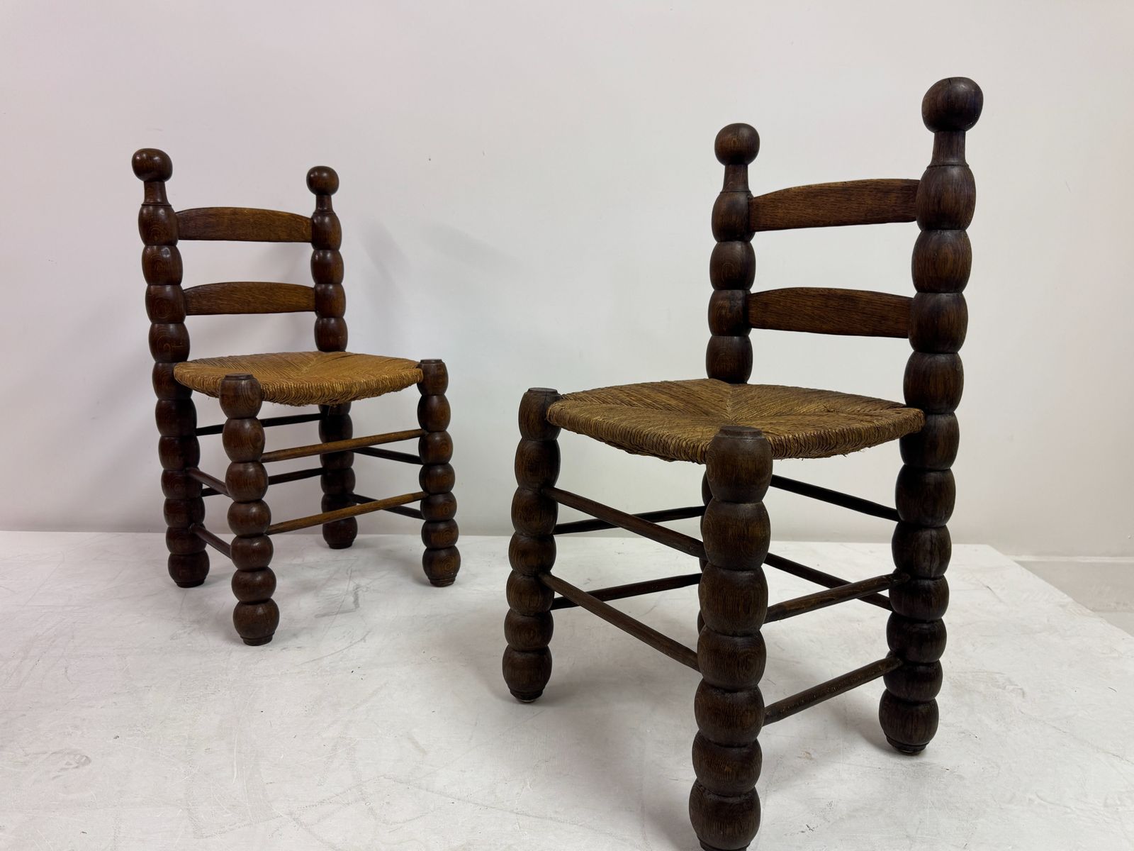 photo vintage Pair Of French Turned Wood Chairs With Rush Seats, In The Style Of Charles Dudouyt, 1940s