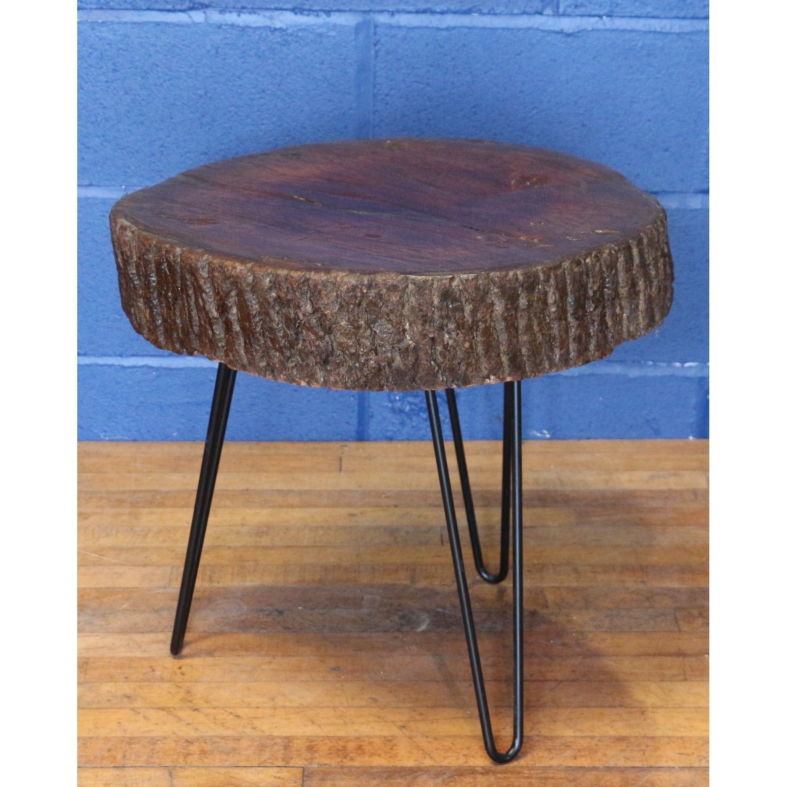 A Rustic Waxed And Polished Tree Slice Coffee Table With Live Edge And Hairpin Legs