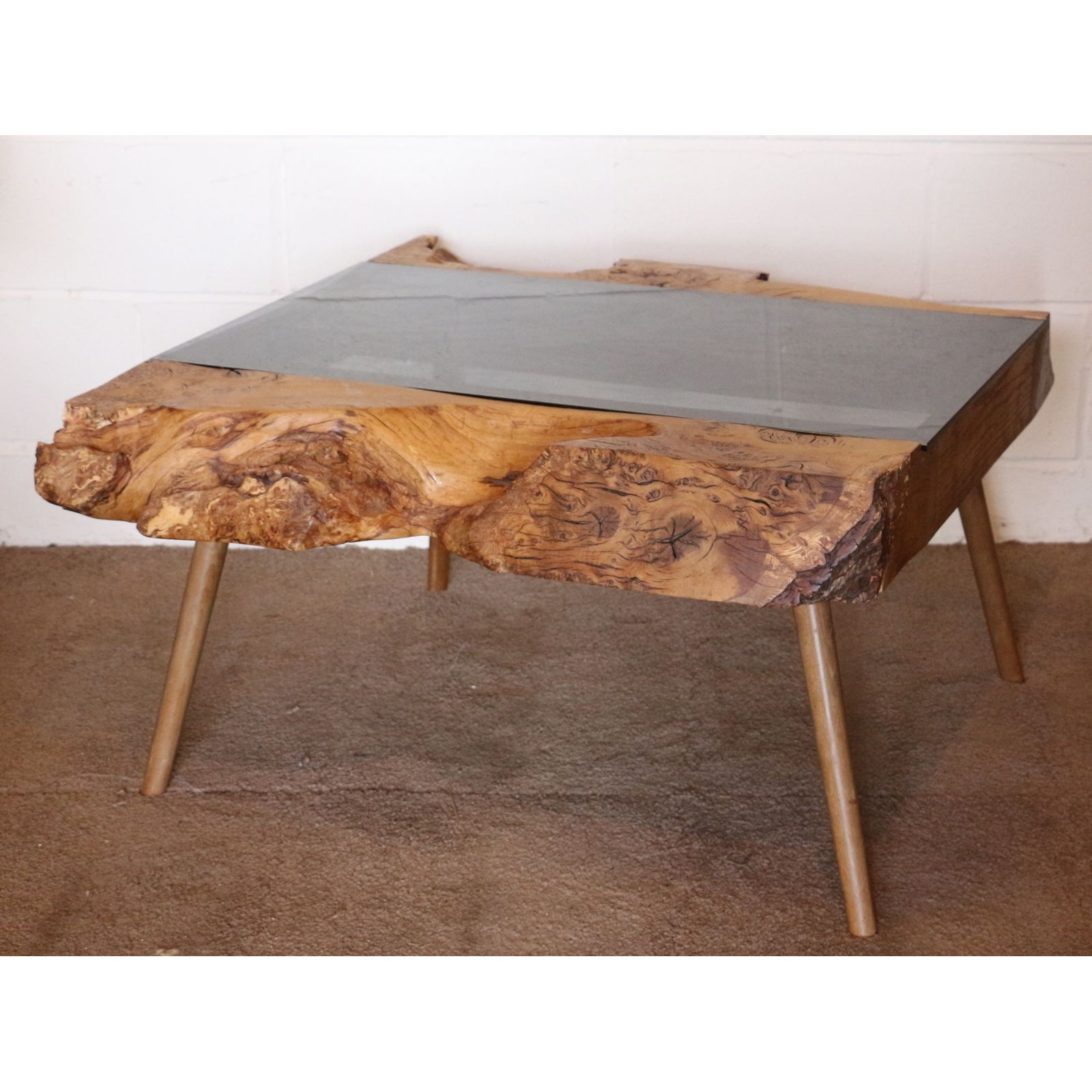 A Bur Wood & Smoked Glass Coffee Table Raised On Angled Tapering Supports