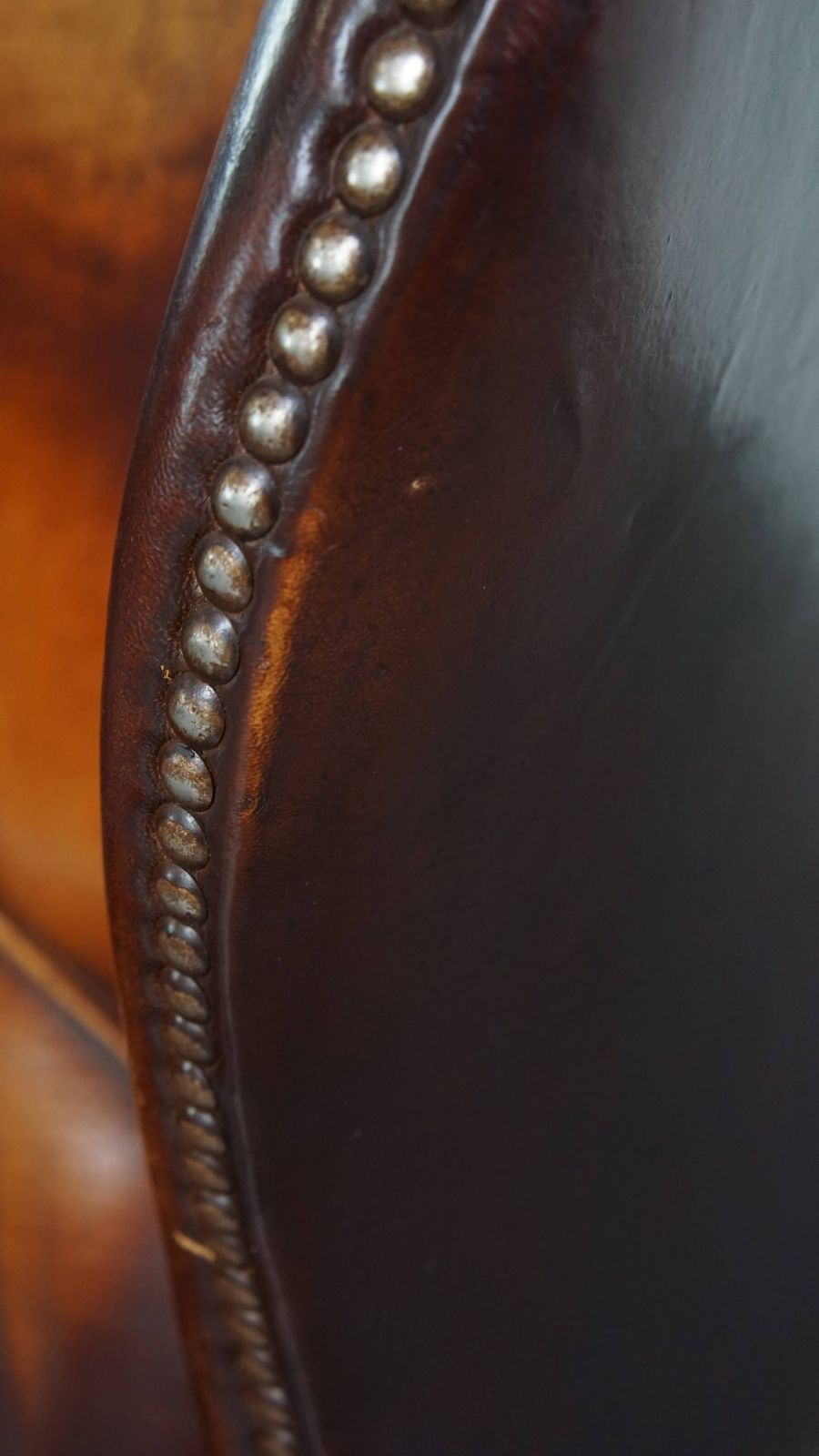 1038.0 Luxurious, Classic And Comfortable Dark English Style Sheepskin Wing Chair With Lots Of Character And A Beautiful Patina photo