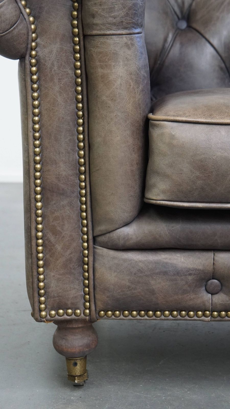 Furniture Unique And Spacious Gray Cowhide Chesterfield Club Armchair In English Style On Wheels photo