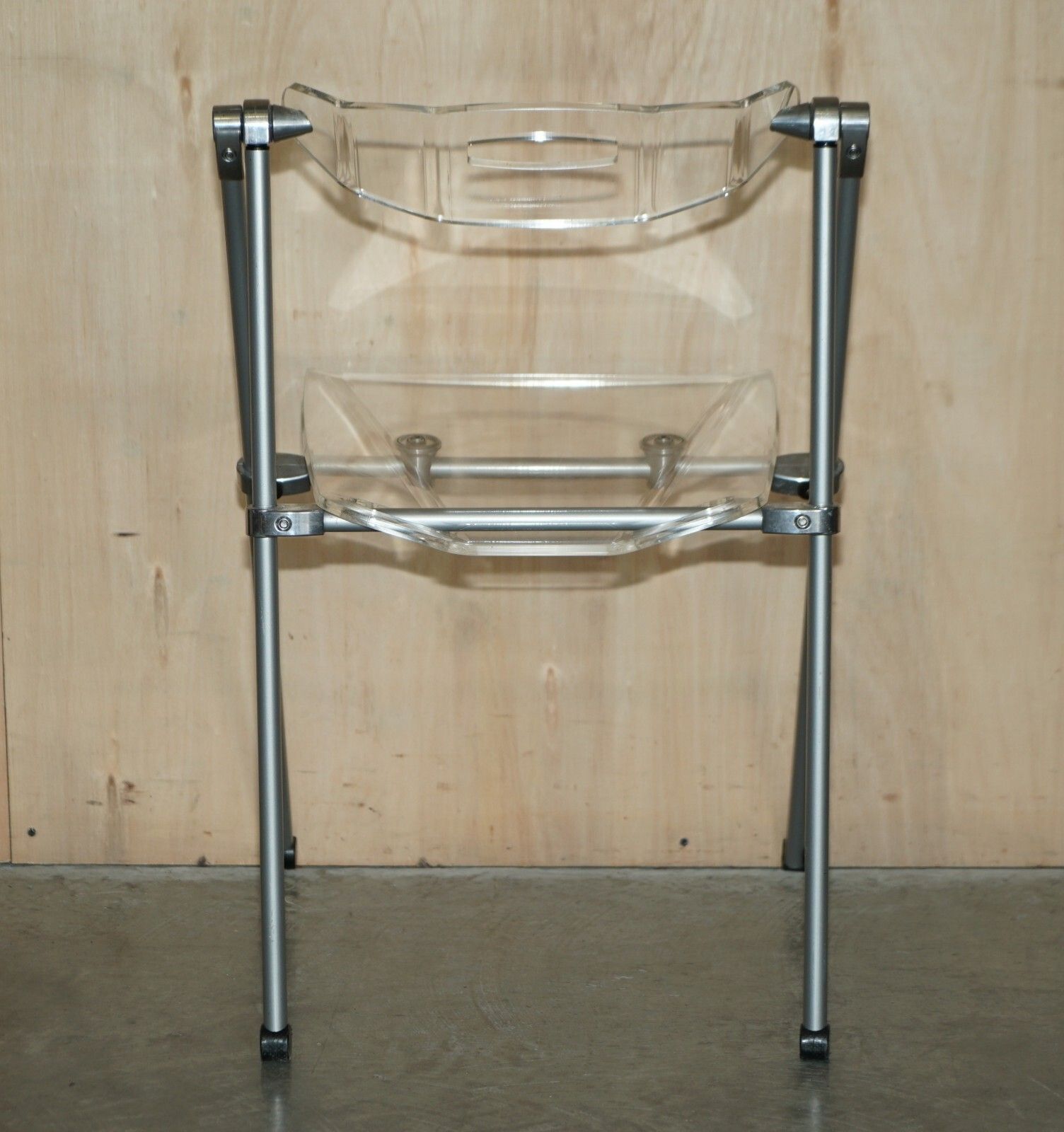 photo furniture Seriously Cool Over Engineered Metal & Lucite Folding Office Chair Swing Back