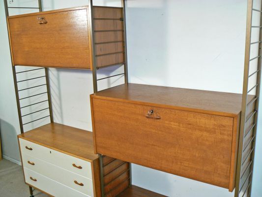 A Wall Leaning Gold Metal Ladderax System, C1960s photo furniture