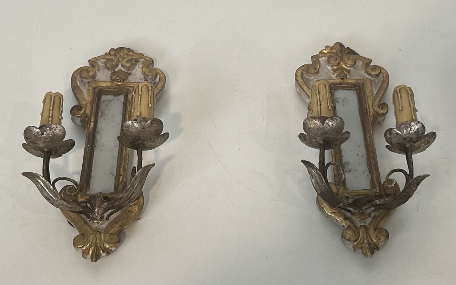 Pair Of Wall Lights In Carved Wood And Silver And Gold Patinated Metal With A Mirror In The Center photo for sale