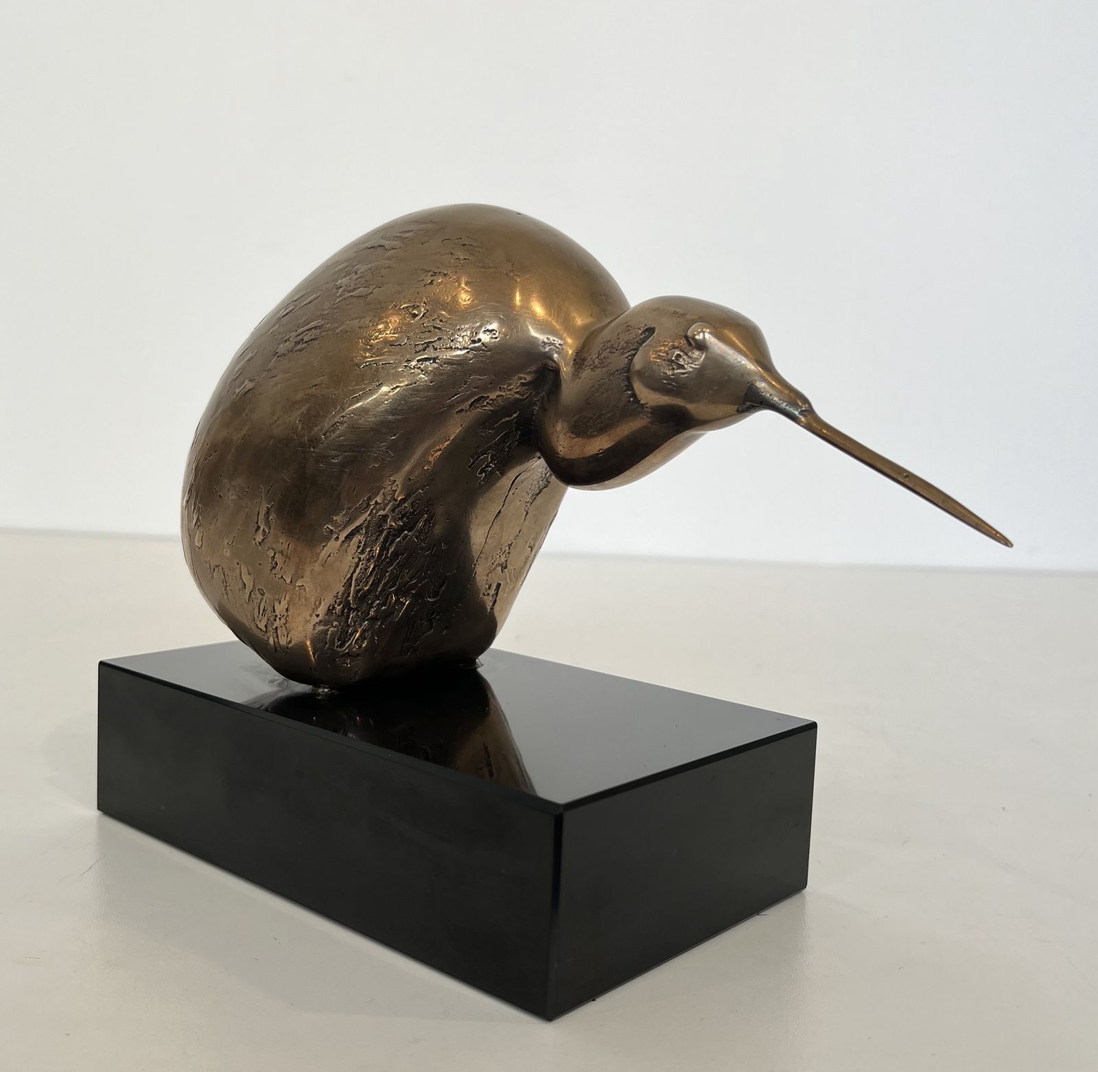 Bronze Sculpture Representing A Stylized Bird On A Black Marble Base, Signed And Numbered photo for sale