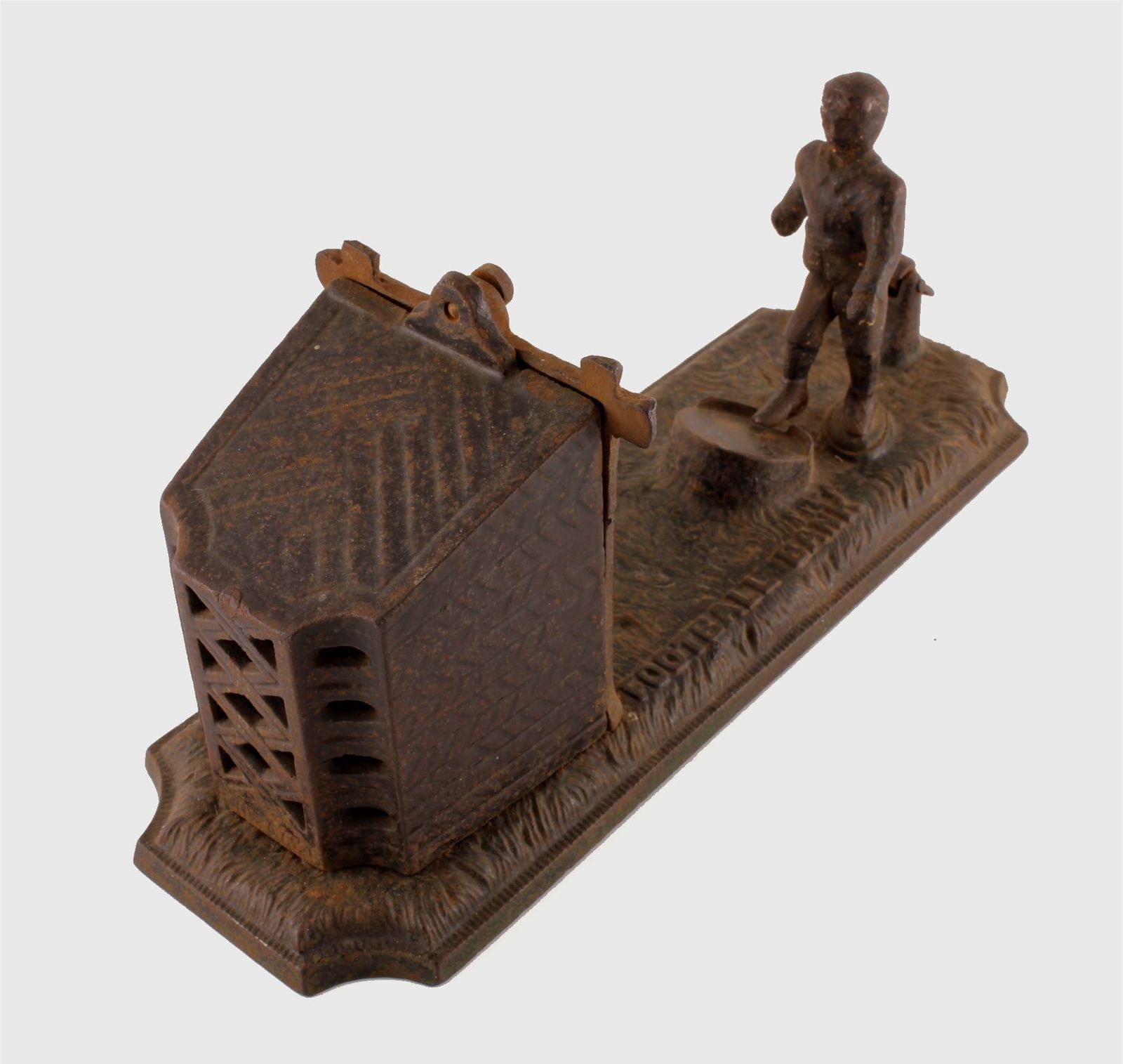 photo vintage Cast Iron Football Bank. Victorian Mechanical Money Box. John Harper Co.