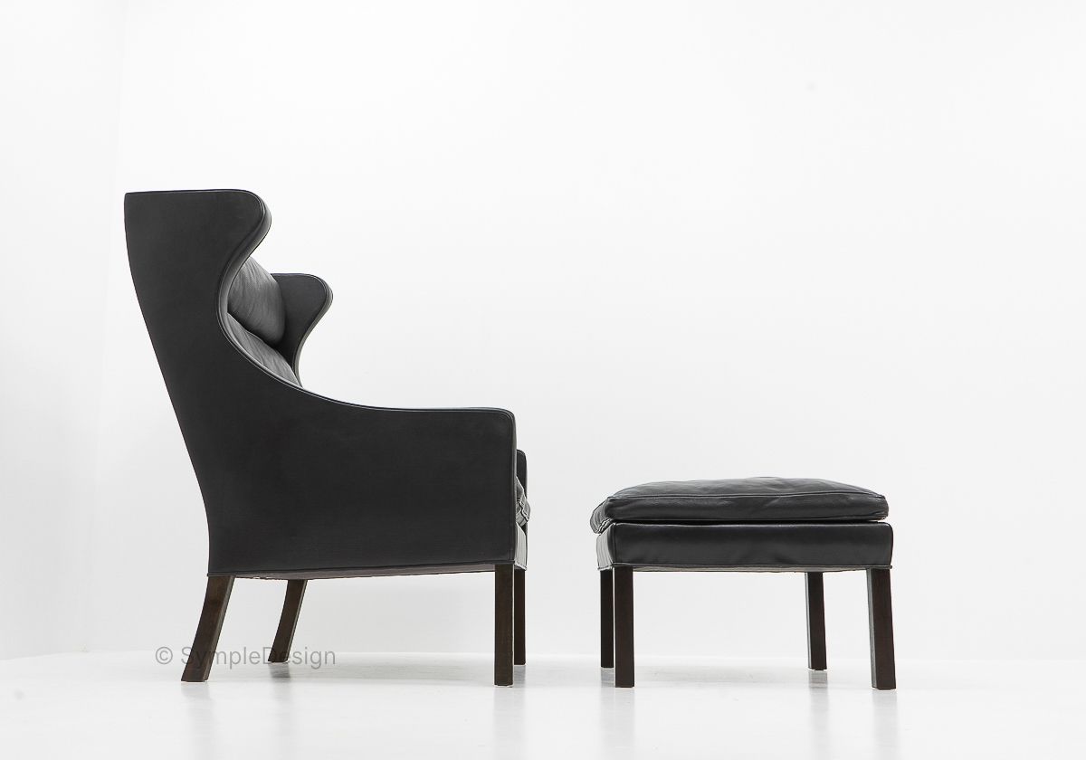 Black Leather Wingchair And Footstool By Borge Mogensen, 1960s photo vinterior