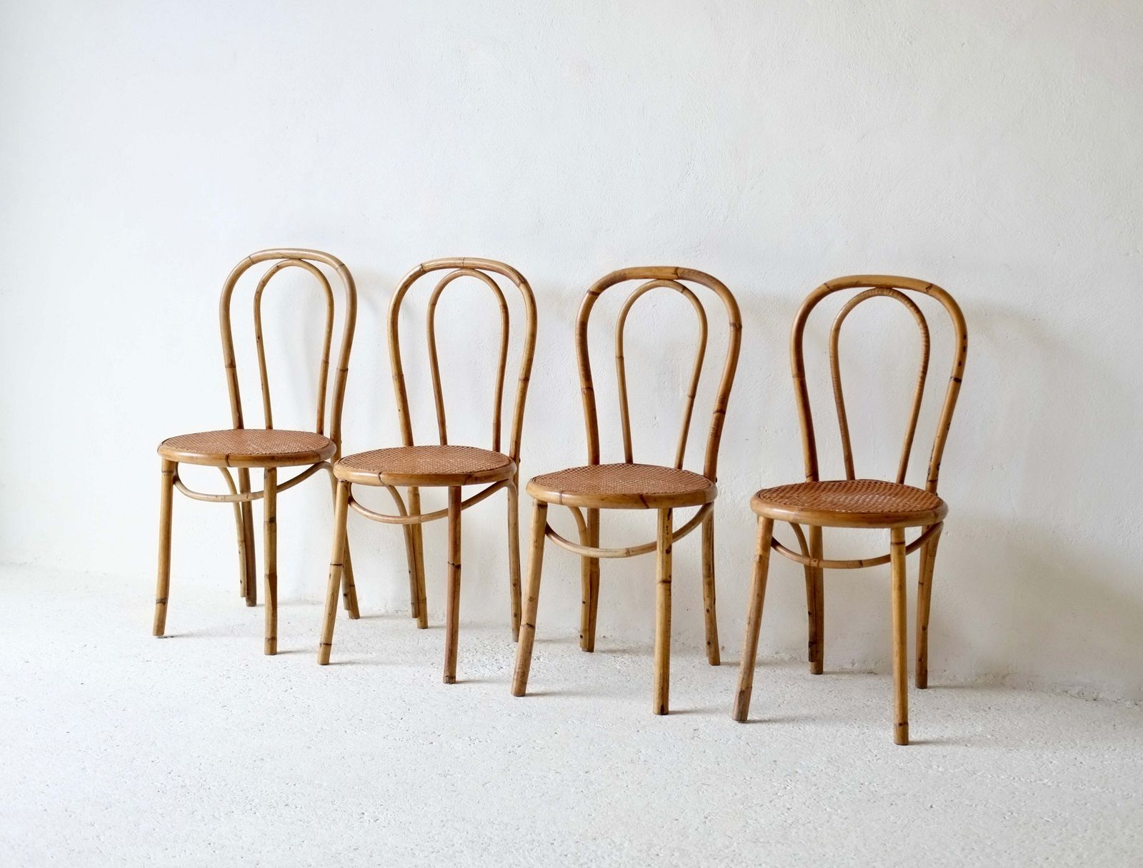 A Set Of Four French Midcentury Bamboo Dining Chairs