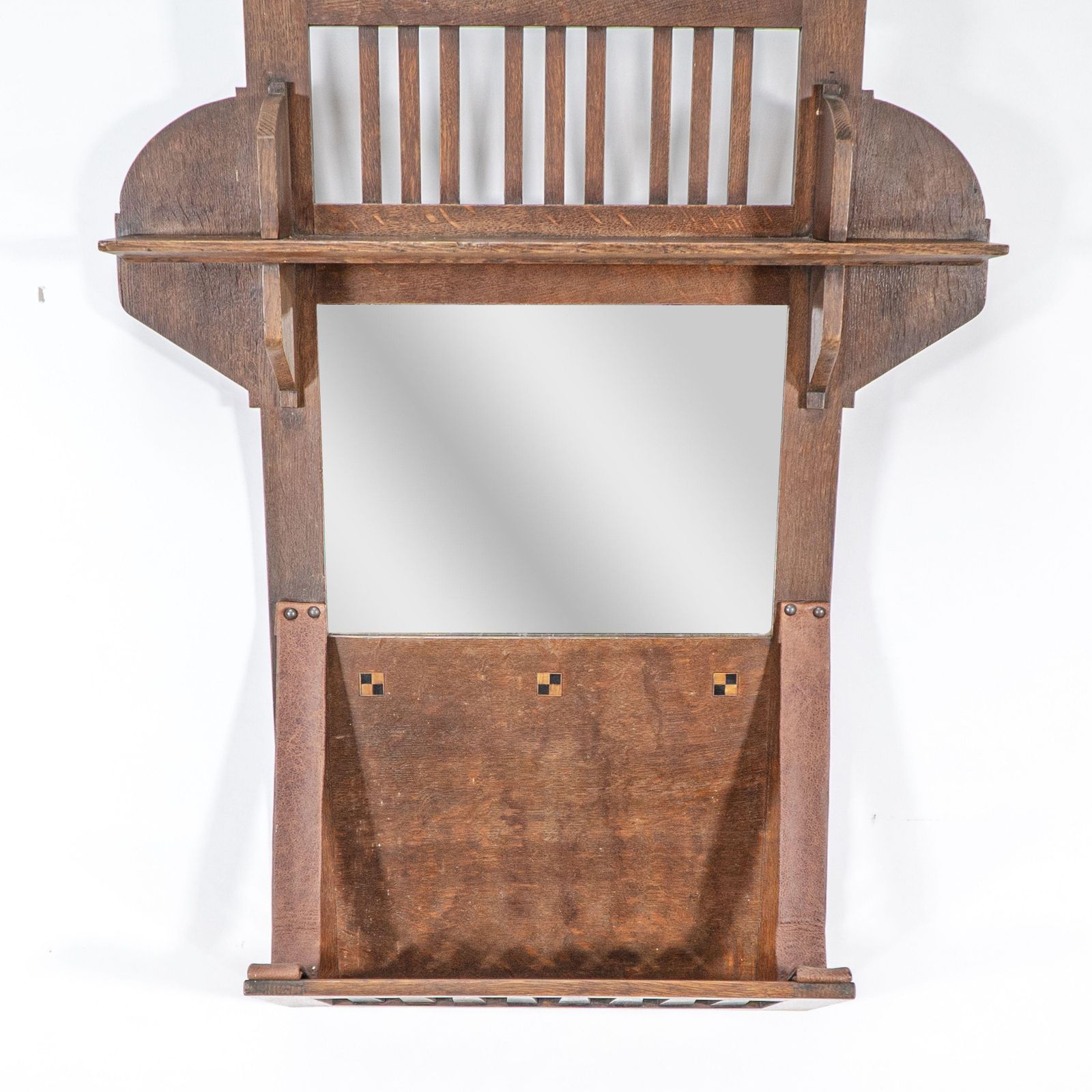 photo furniture Liberty And Co. An Arts & Crafts Oak Hanging Paper Rack With Central Mirror