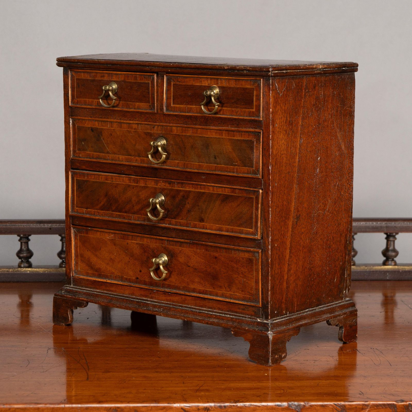 A Fine Georgian Walnut Miniature Chest Of Drawers photo furniture