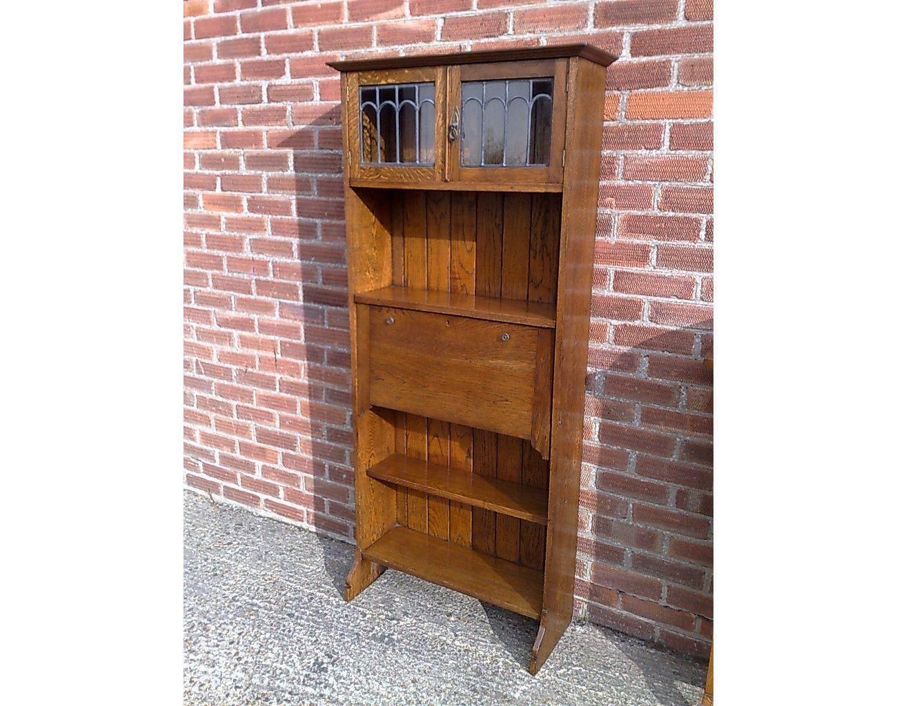 An Arts And Crafts Tall Oak Bureau Bookcase With Leaded Glass Doors photo for sale