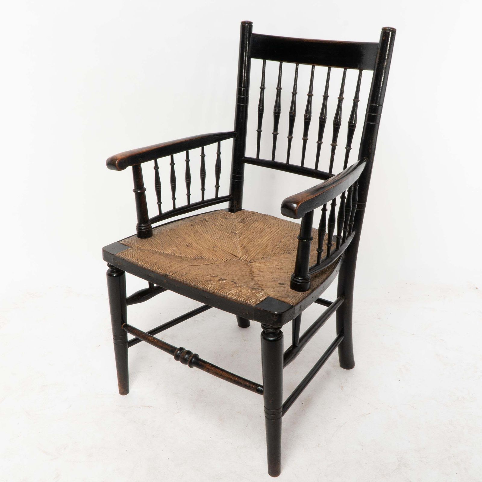 Liberty & Co, Attributed. An Aesthetic Movement Rush Seat Armchair photo for sale