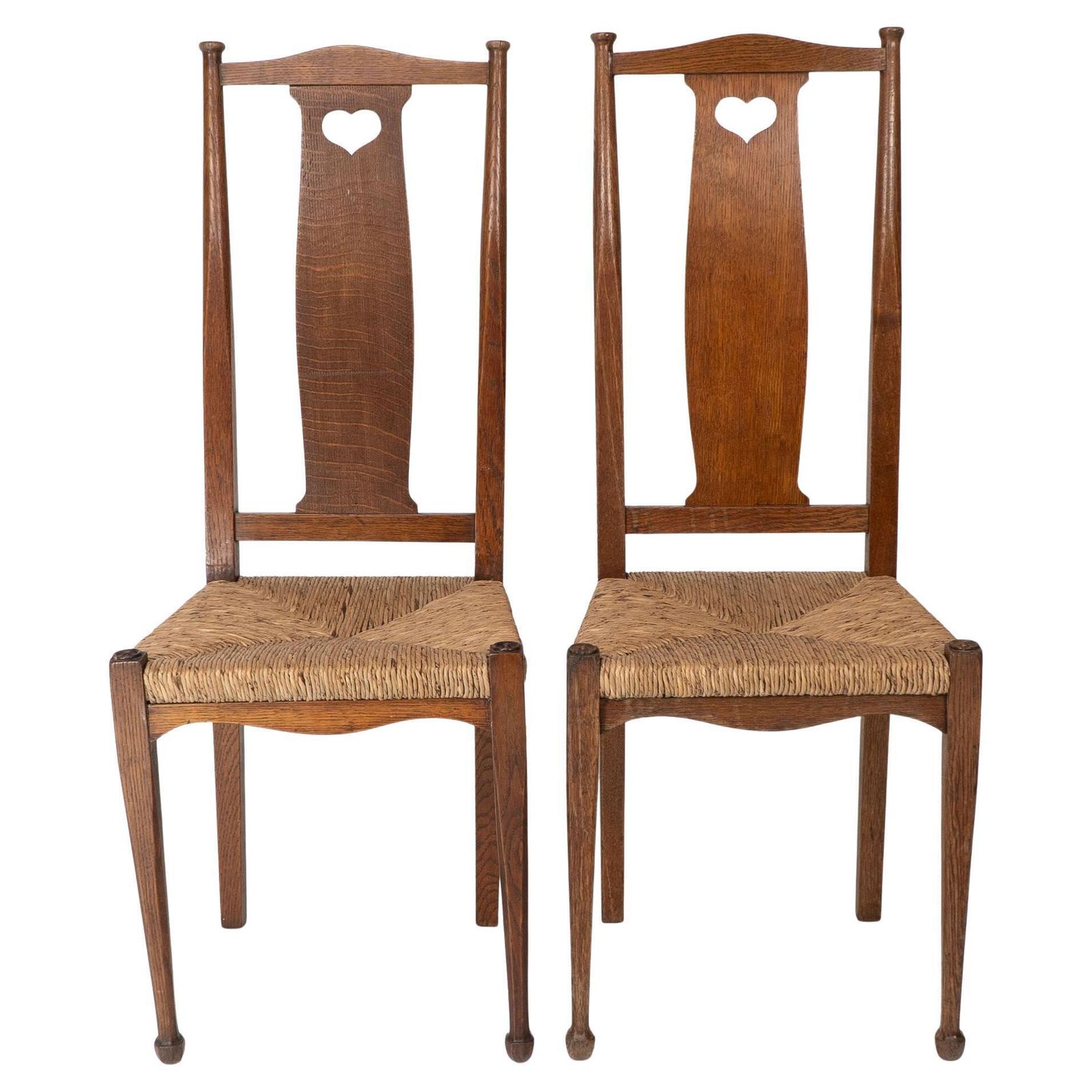 Ambrose Heals For Heals Of London. A Pair Of Arts And Crafts Rush Seated Chairs