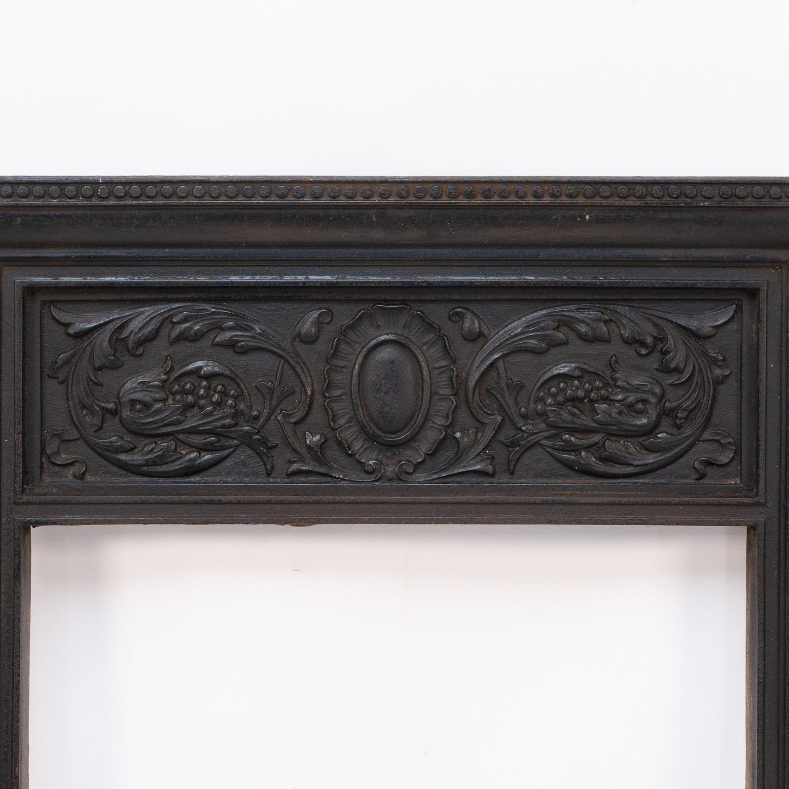A Late Victorian Fireplace With Stylized Floral Details To The Top photo for sale