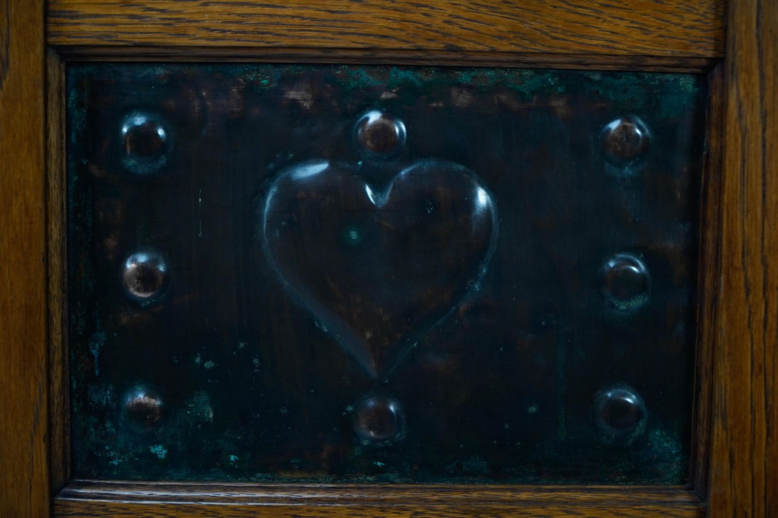 867.0 Shapland & Petter. An Arts & Crafts Oak Planter With Copper Heart Shaped Panels photo