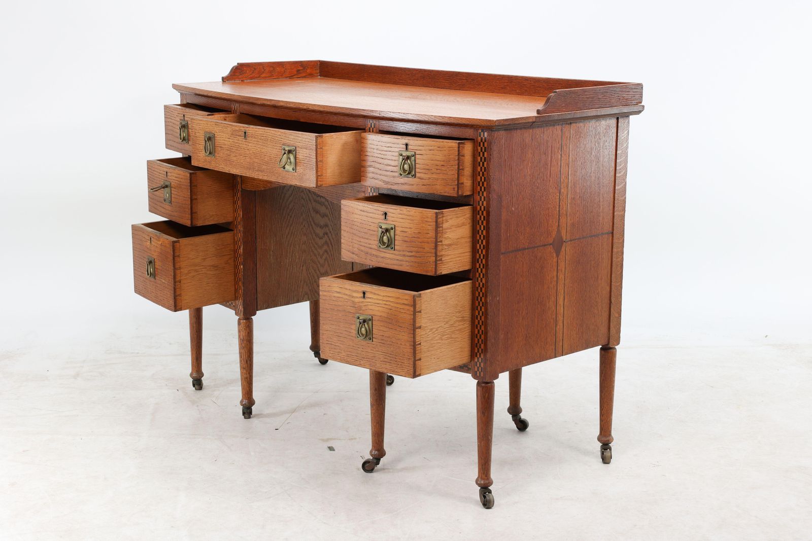 Waring And Gillow. An Arts And Crafts Bow Fronted Kneehole Twin Pedestal Desk photo for sale
