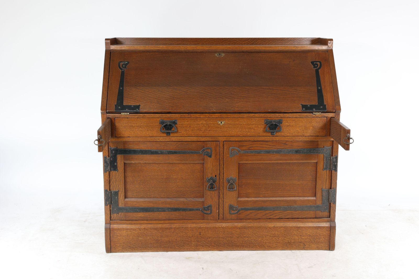 Leonard Wyburd For Liberty & Co. An Arts & Crafts Oak Bureau With Iron Hinges photo for sale