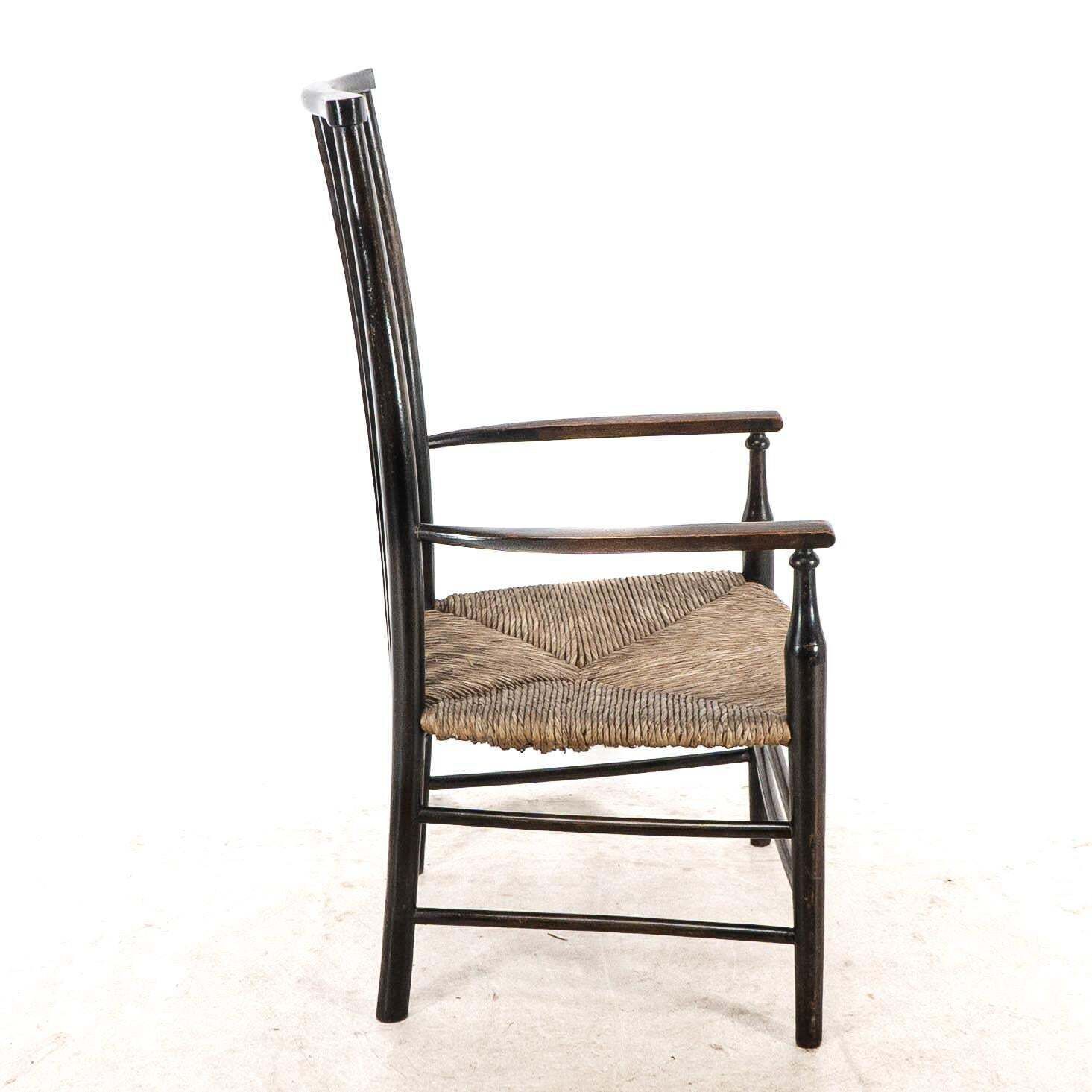 Liberty & Co. An Arts & Crafts Rush Seat Armchair With Wavy Shaped Back Slats photo Furniture