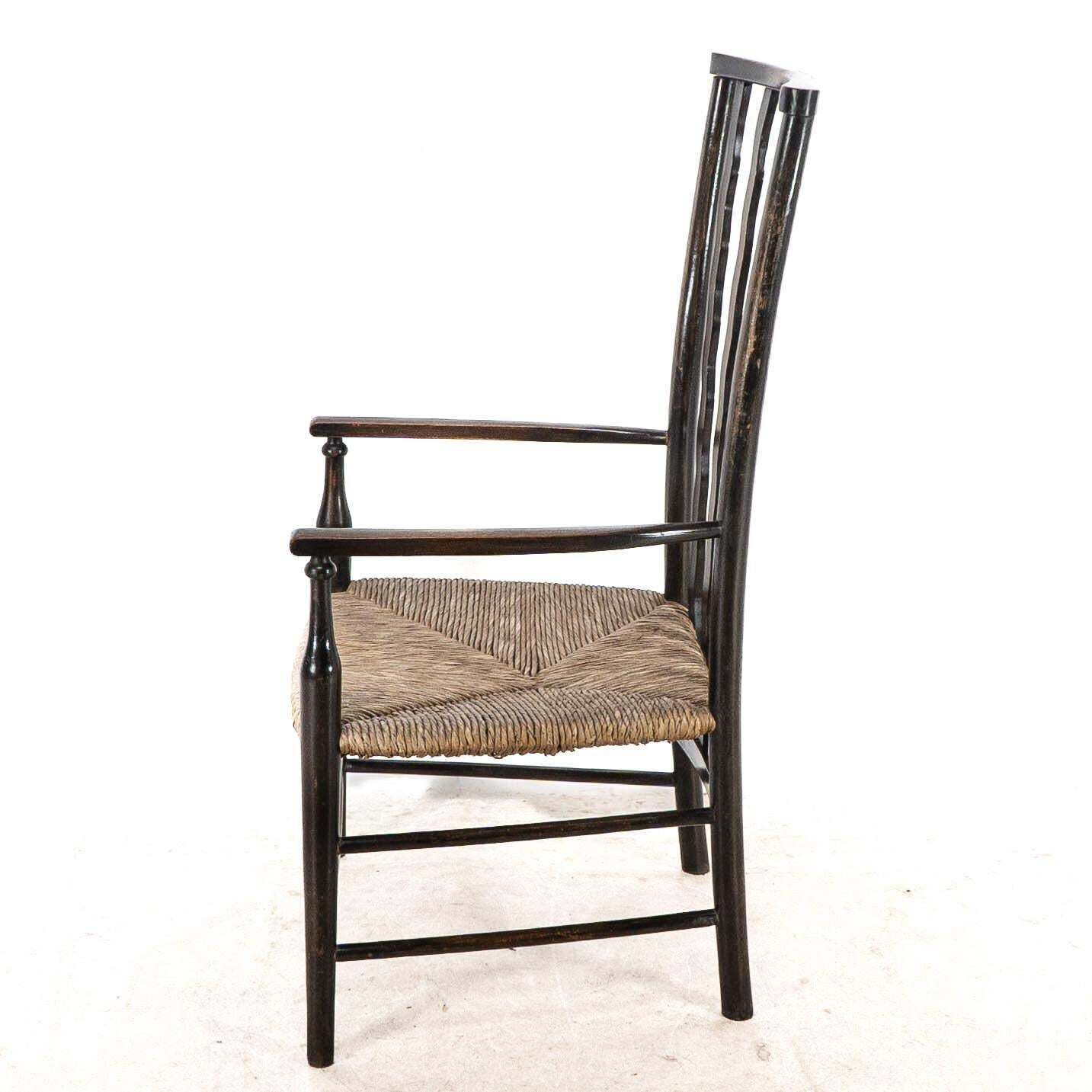 Liberty & Co. An Arts & Crafts Rush Seat Armchair With Wavy Shaped Back Slats photo 870.0