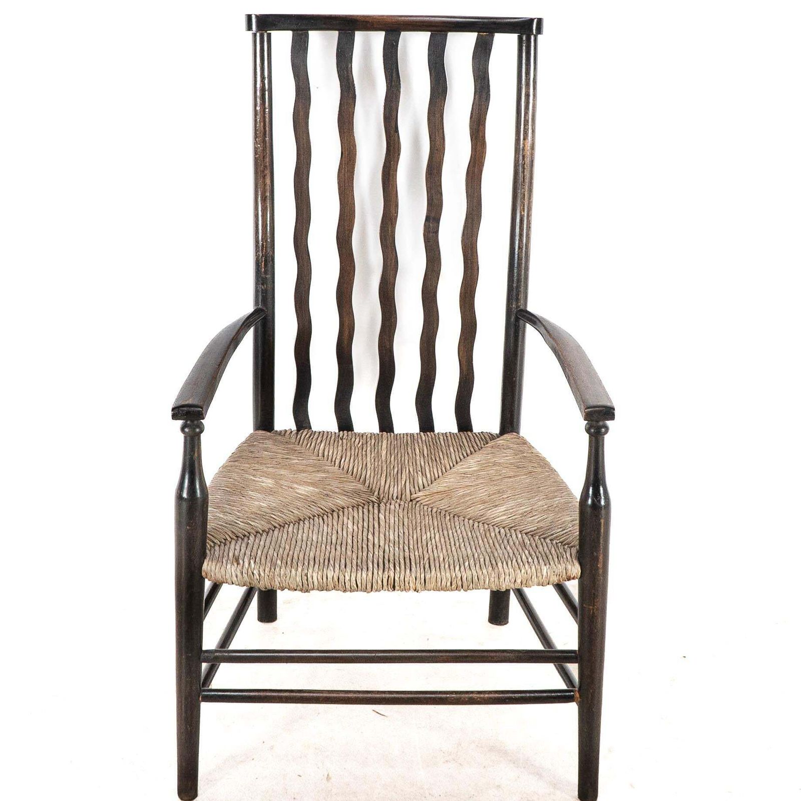 Liberty & Co. An Arts & Crafts Rush Seat Armchair With Wavy Shaped Back Slats photo vinterior