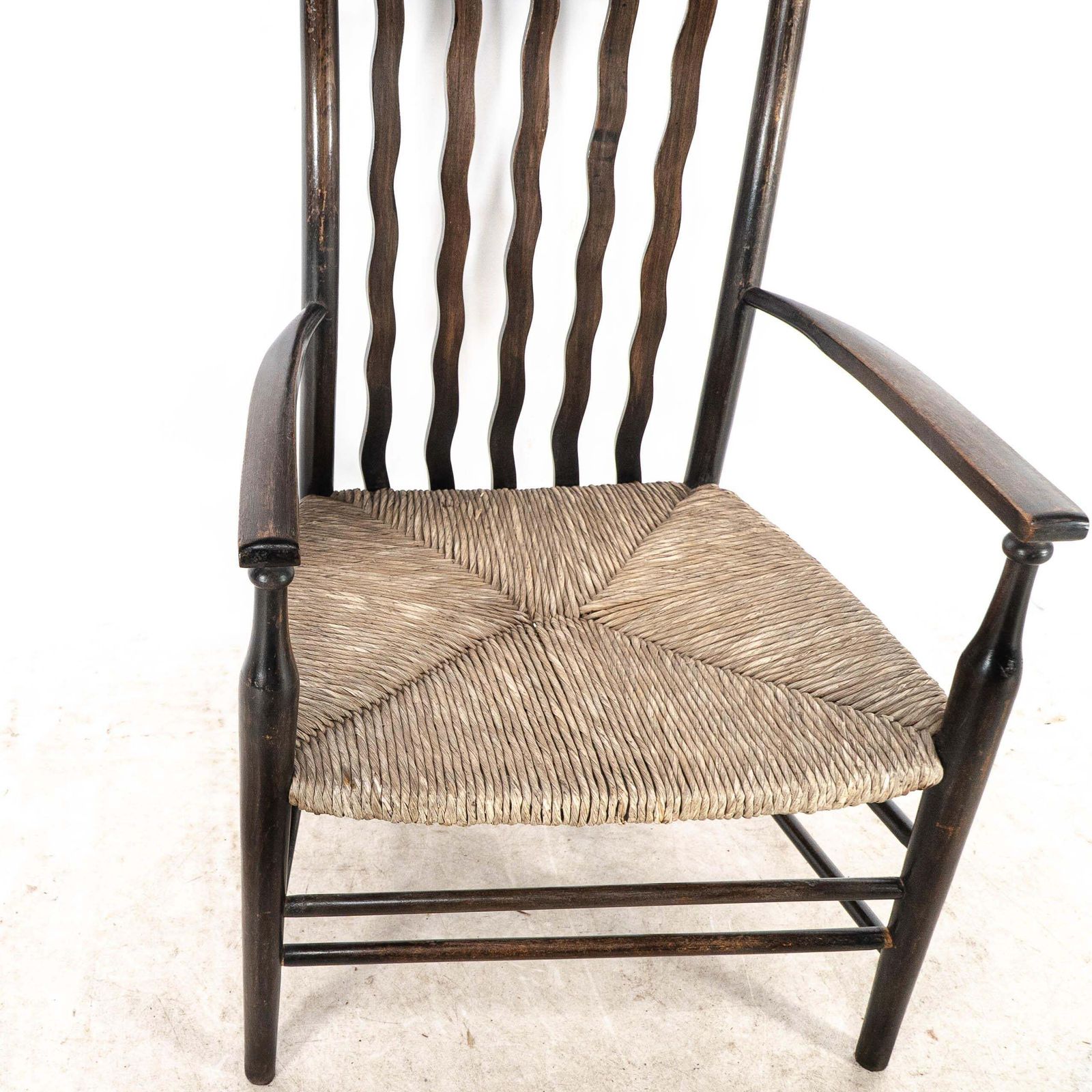Furniture Liberty & Co. An Arts & Crafts Rush Seat Armchair With Wavy Shaped Back Slats photo