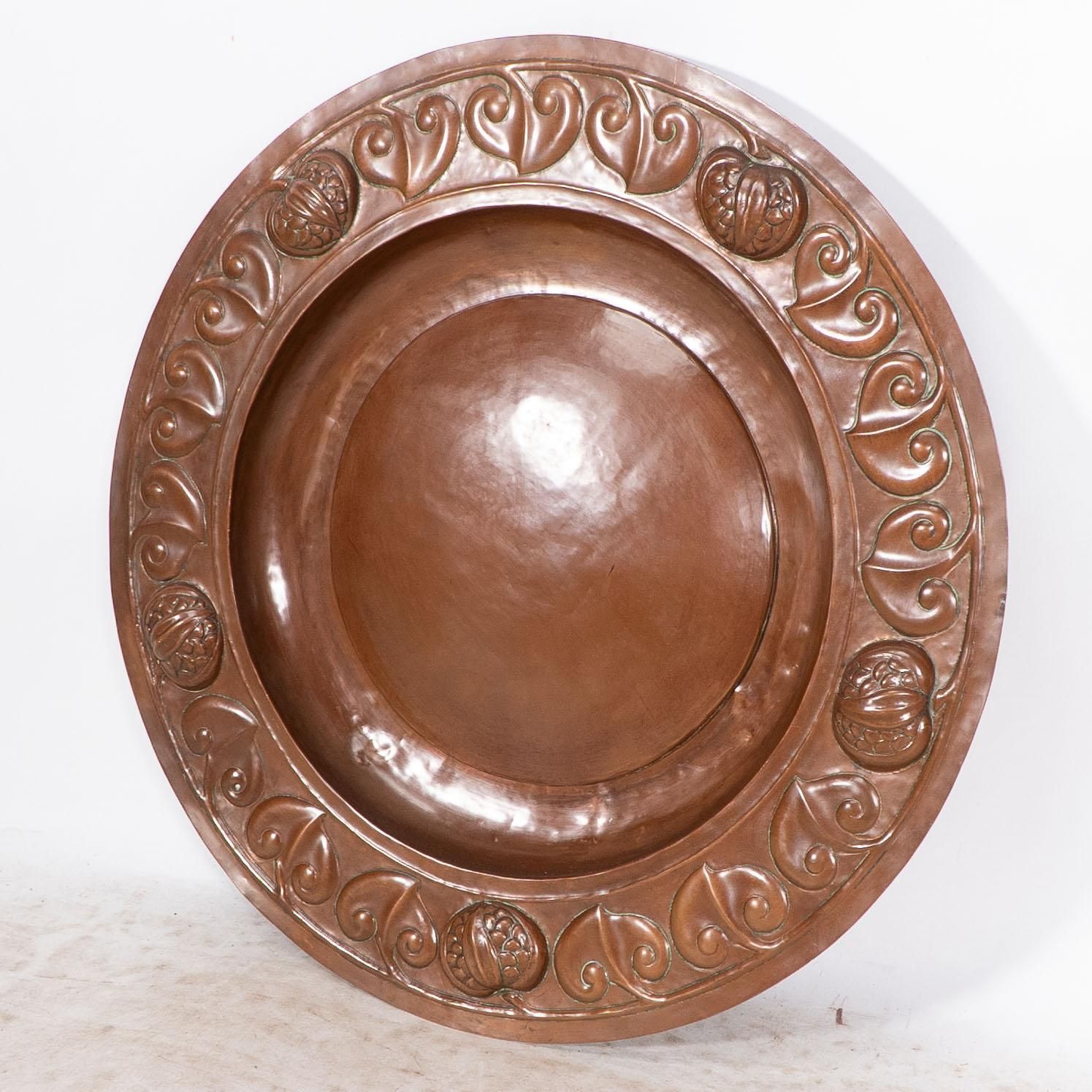 A Large Arts And Crafts Hand Formed Copper Charger With Stylized Decoration photo furniture
