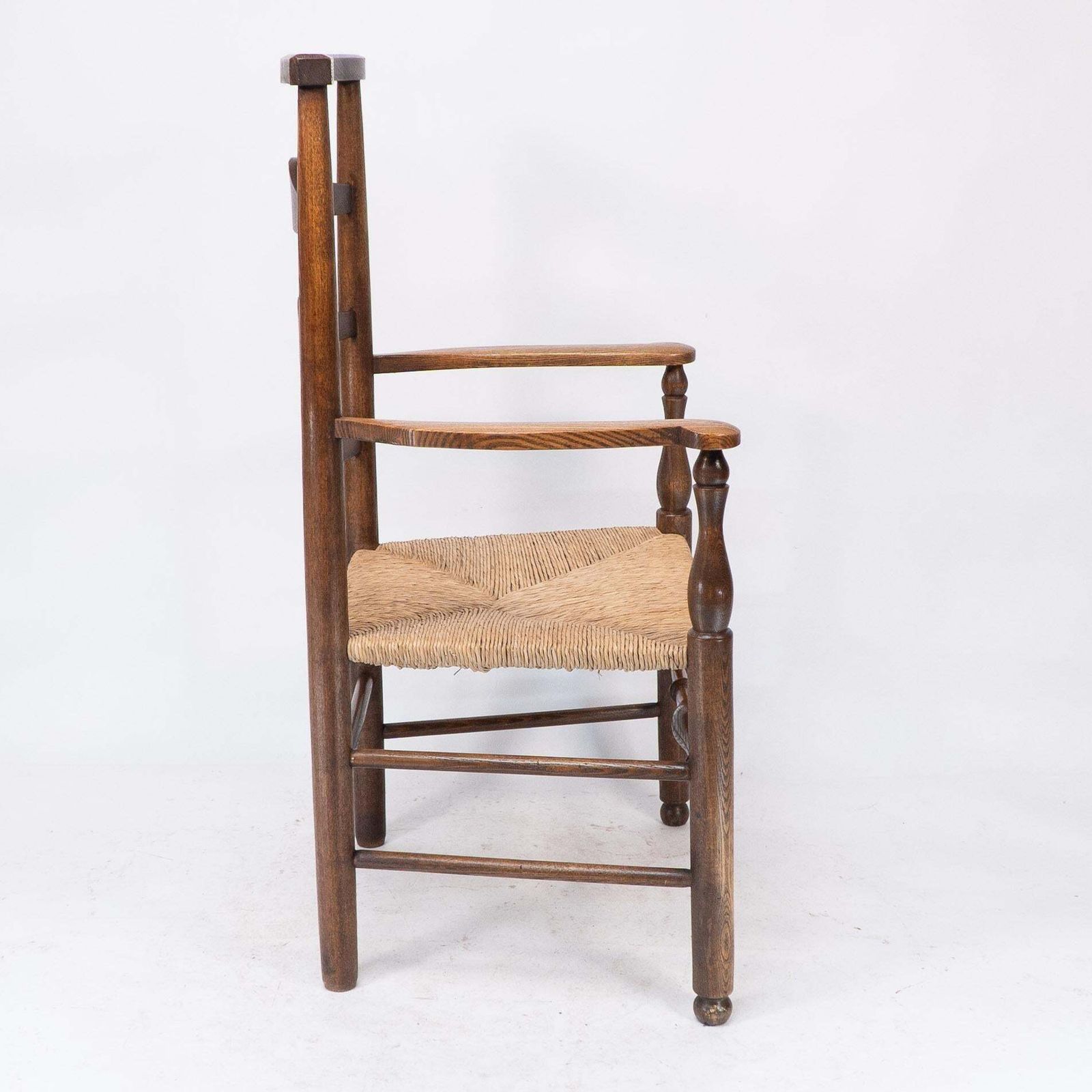 C R Ashbee Attr. An Arts & Crafts Oak Ladder Back Armchair With Re Rushed Seat photo 2550.0