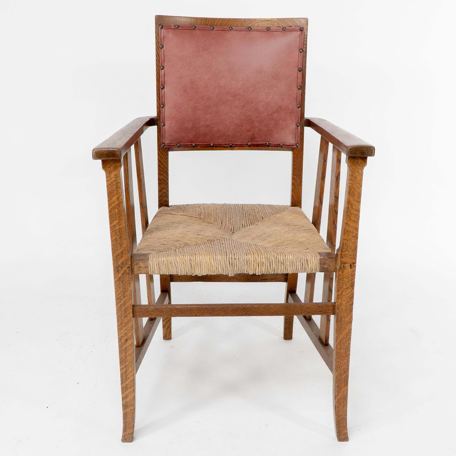 Liberty & Co. An Arts & Crafts Rush Seat Armchair With A Shaped Back photo furniture