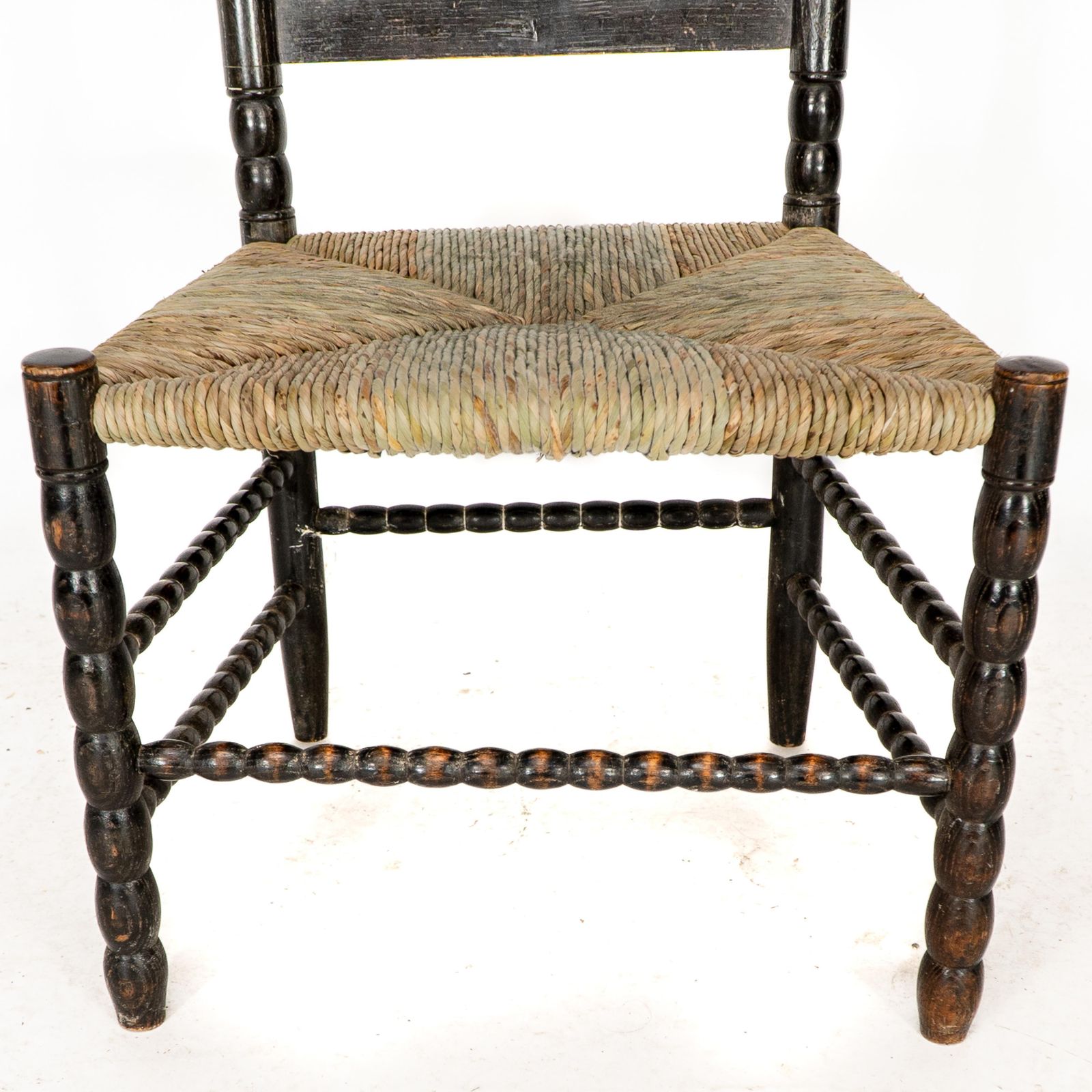 2243.0 Ernest Gimson. A Rare Cotswold School Ebonised Bobbin Turned Rush Seat Low Chair photo