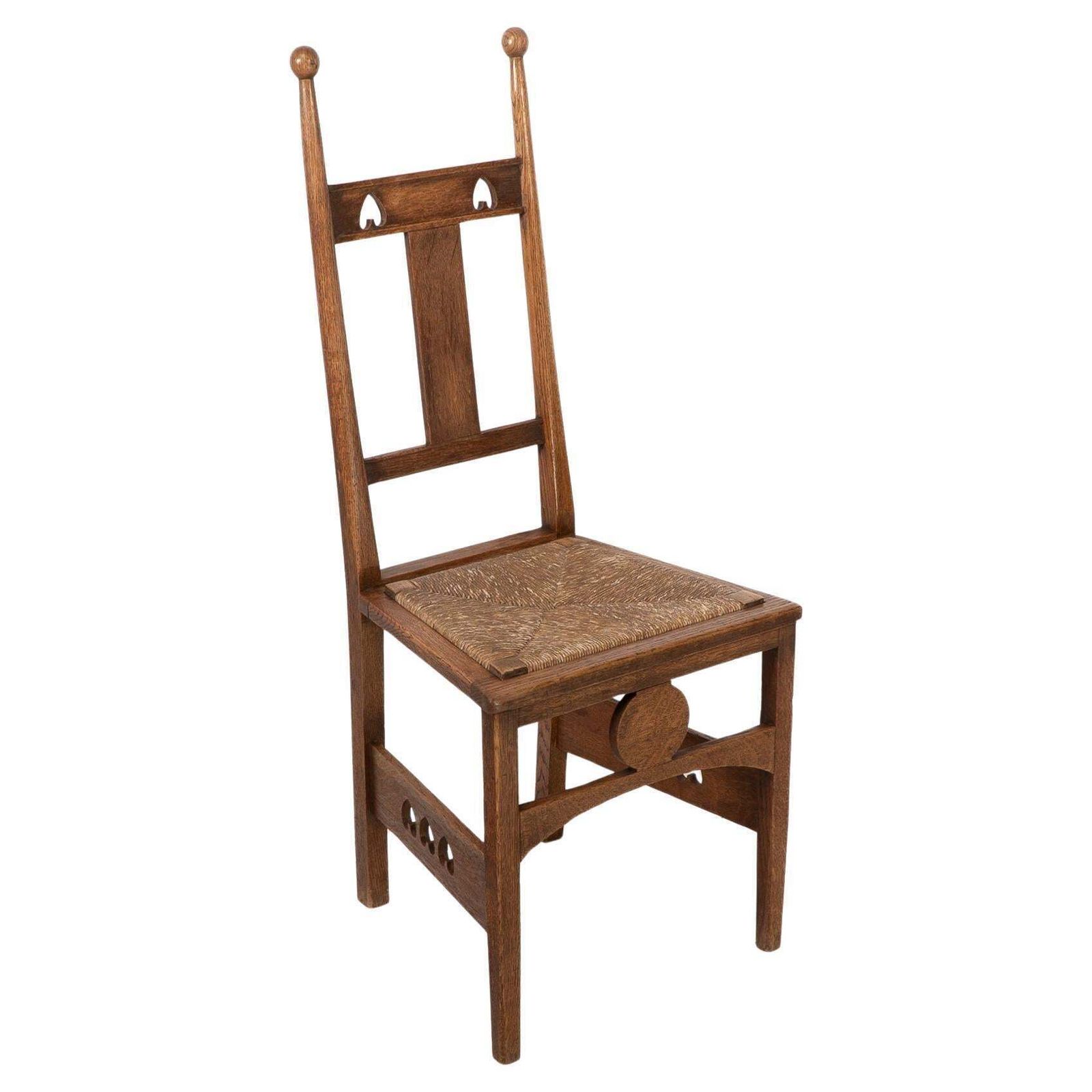 Shapland & Petter. An Arts & Crafts Oak Desk Or Side Chair With Pierced Hearts