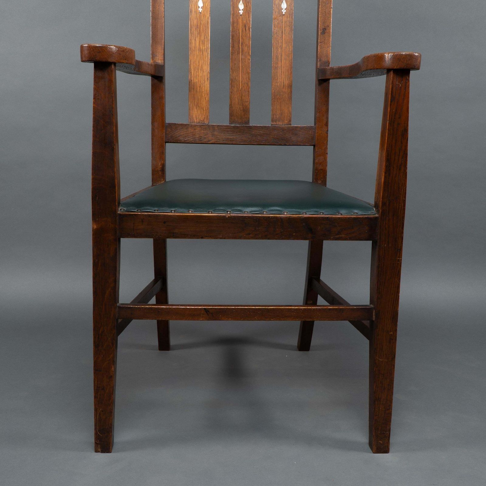 photo vintage Liberty & Co Attributed. An Arts & Crafts Oak Armchair With Inlaid Royal Crown