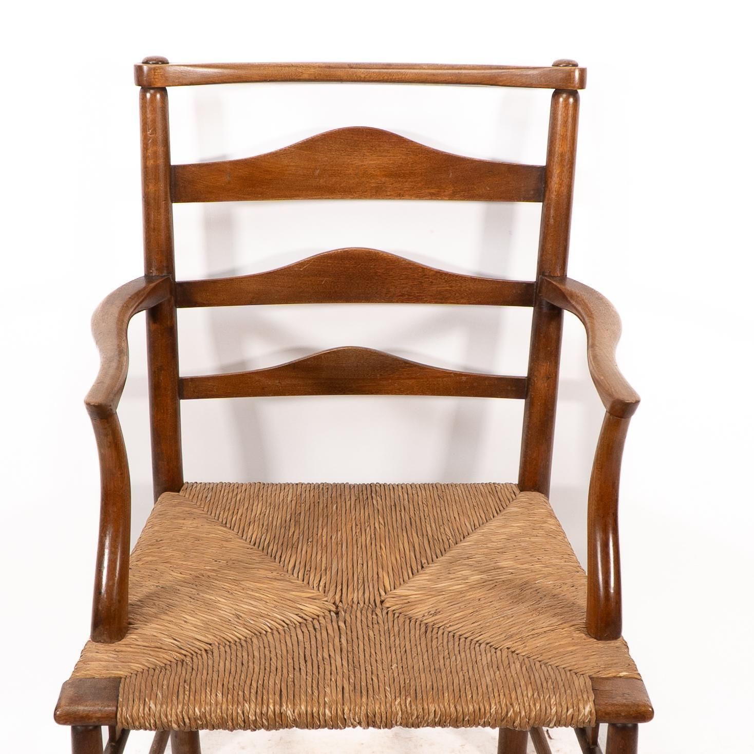 C R Ashbee. An Arts And Crafts Rush Seat Ladder Back Armchair photo vinterior