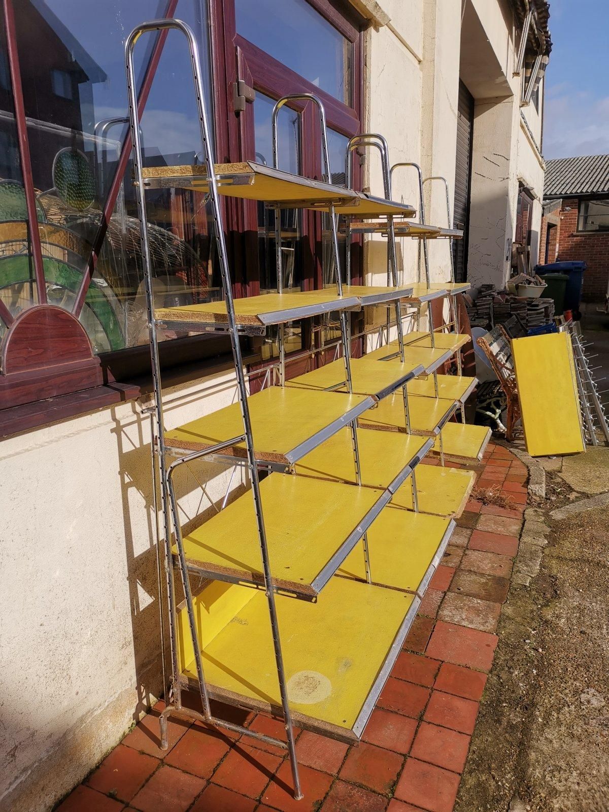 Stylish Midcentury Chrome On Steel Shop Shelving With Braced Back Supports photo Furniture