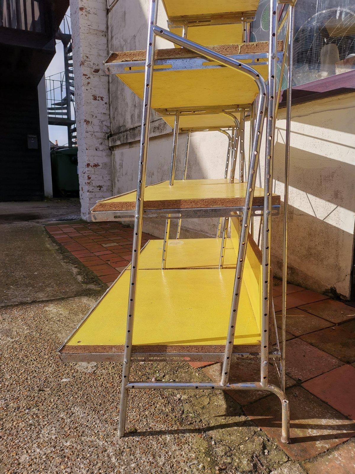 photo furniture Stylish Midcentury Chrome On Steel Shop Shelving With Braced Back Supports