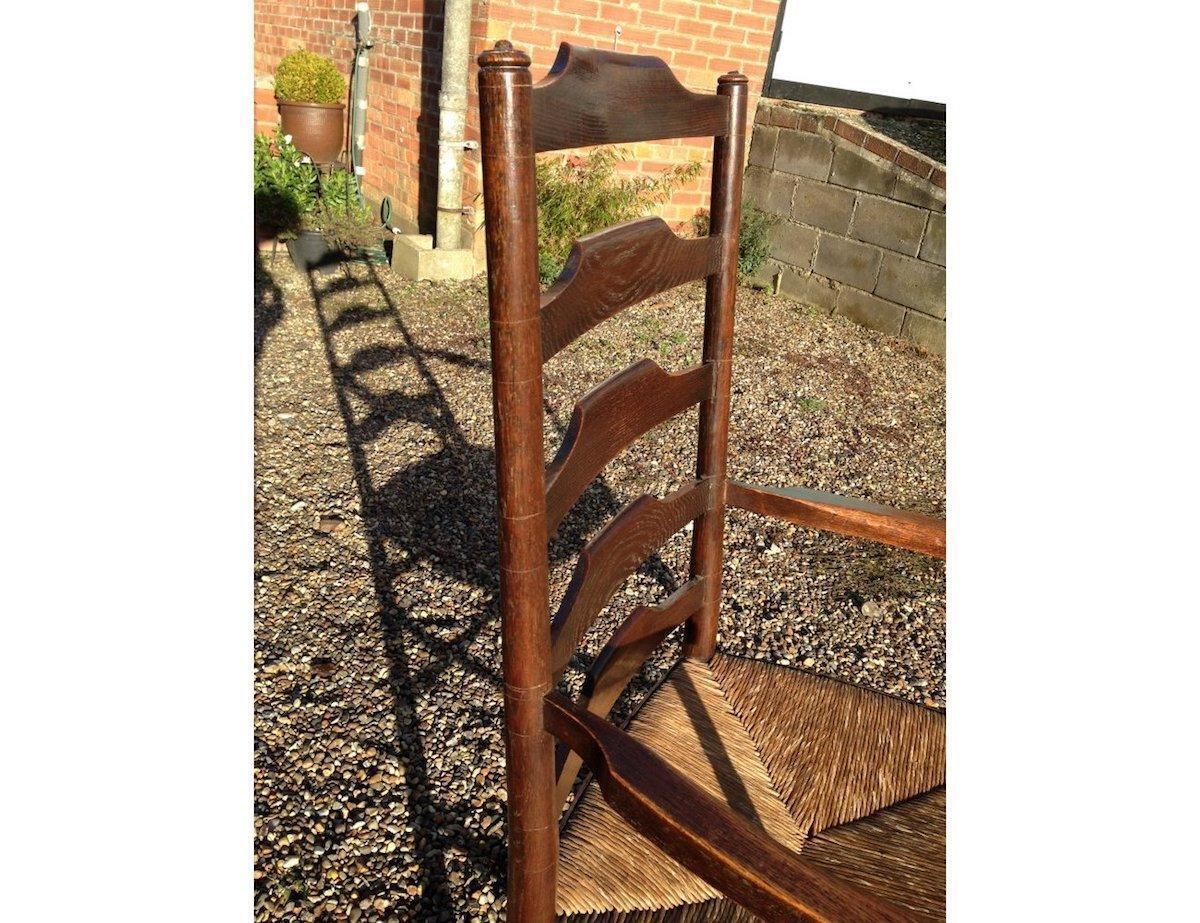 An English Cotswold School Oak Ladder Back Rush Seat Armchair photo Furniture
