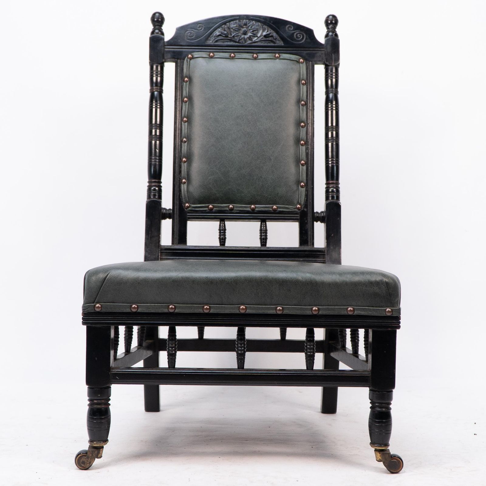 photo furniture Gregory & Co. An Aesthetic Movement Nursing Chair With Stylized Carved Sunflower