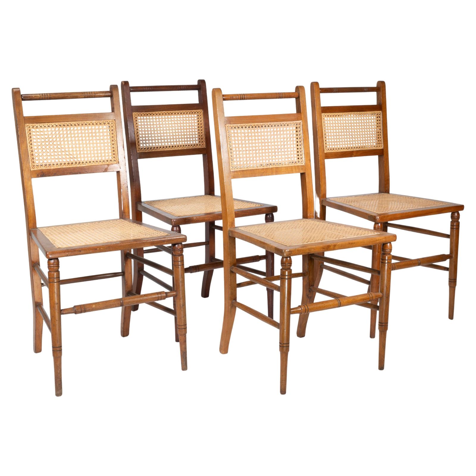E W Godwin (Attributed). A Set Of Four Anglo Japanese Cane Seat Chairs