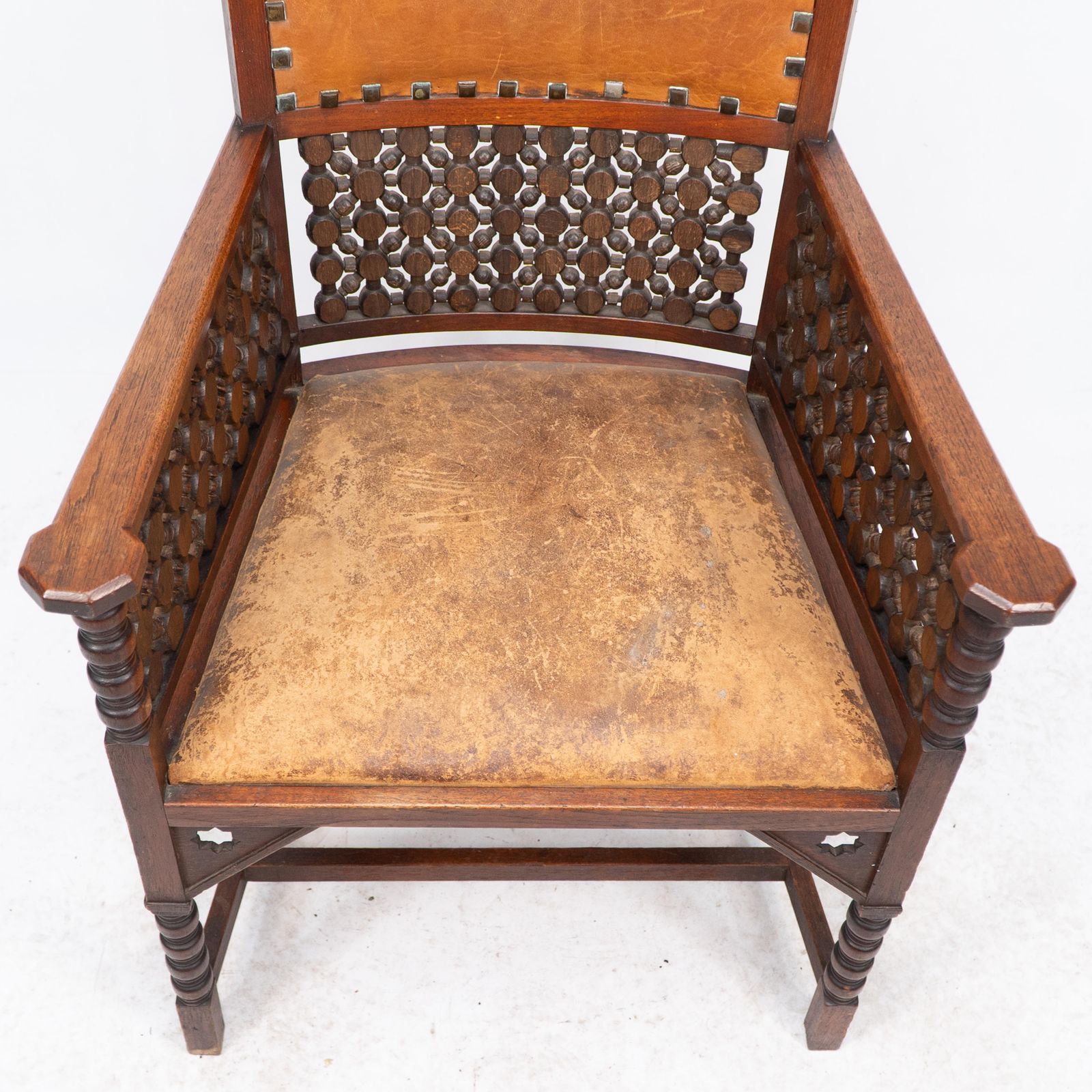 2447.0 Liberty & Co. A Moorish Arts & Crafts Walnut Armchair With Original Leather Seat photo