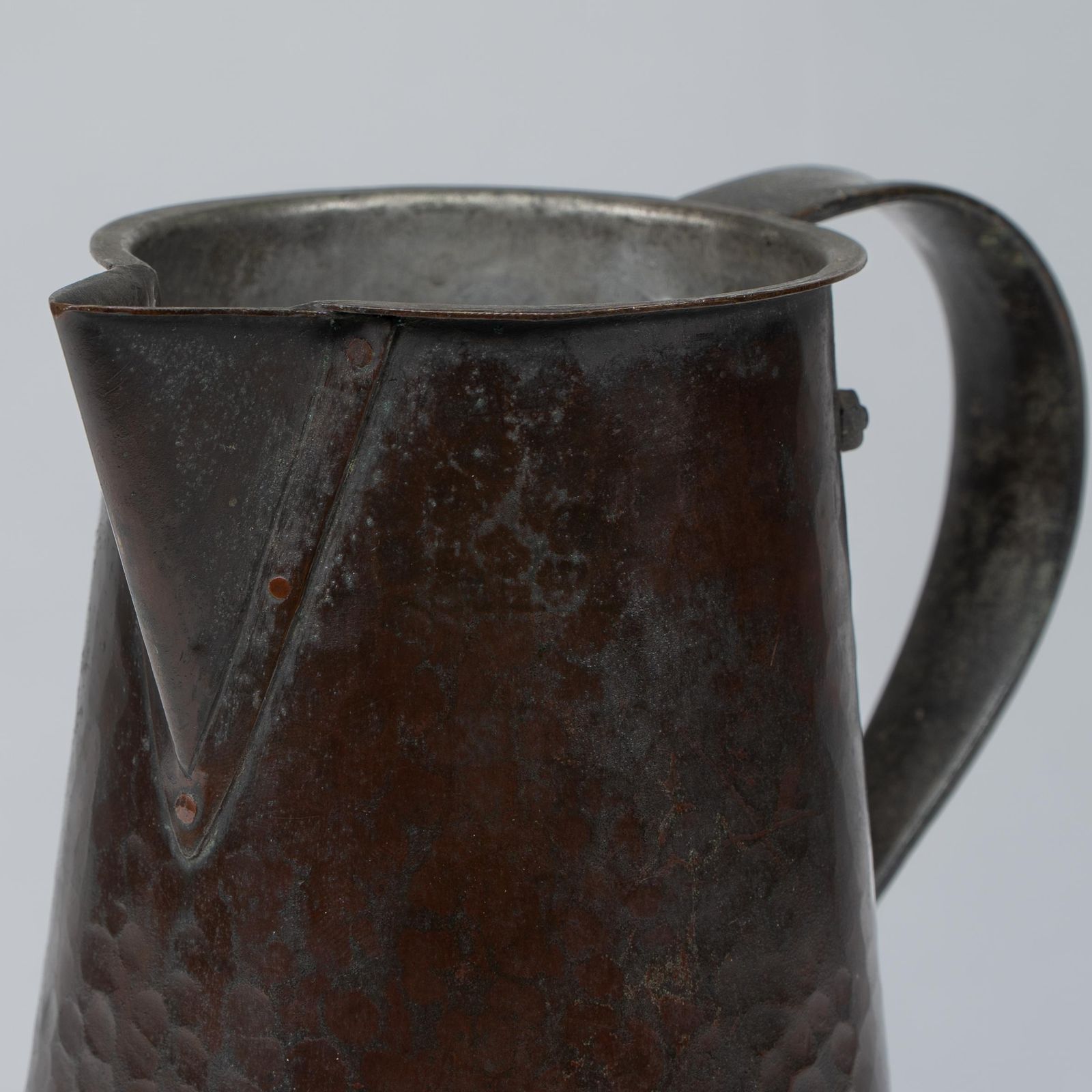 1800.0 Arthur Dixon For The Bgh. An Arts & Crafts Hand Hammered Copper Jug photo