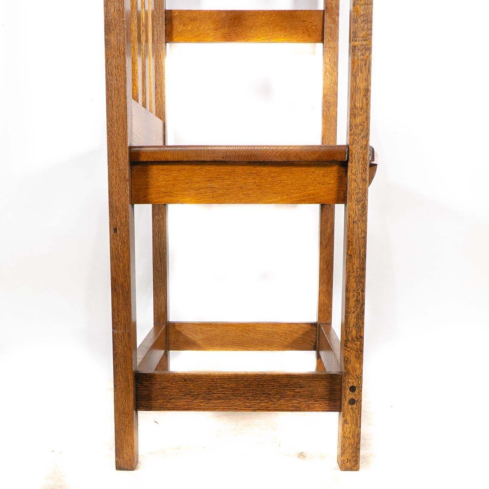 photo vintage An Arts And Crafts Hall Seat In The Glasgow Style With Extended Capped Tops