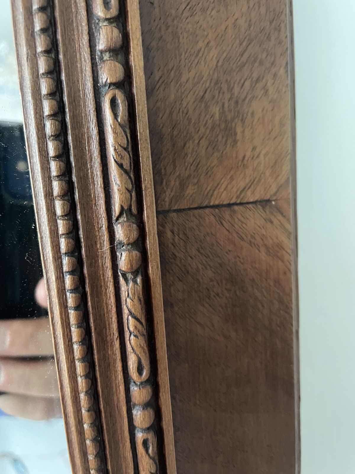 photo buy French Carved Cherry Wood Mirror With A Patterned Frame Featuring Beaded And Entwined Ribbon Detail.