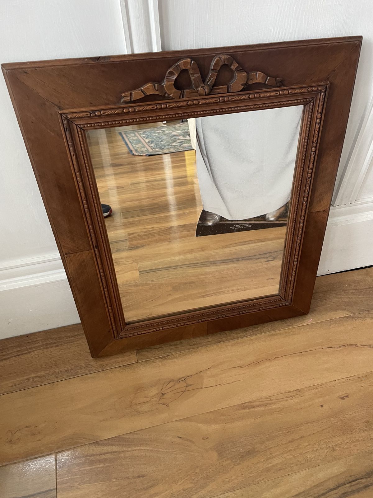 photo for sale French Carved Cherry Wood Mirror With A Patterned Frame Featuring Beaded And Entwined Ribbon Detail.
