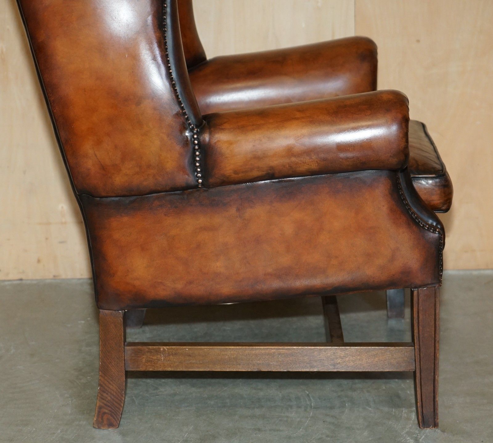 photo buy Comfortable Restored Whiskey Brown Leather Tufted Chesterfield Wingback Armchair