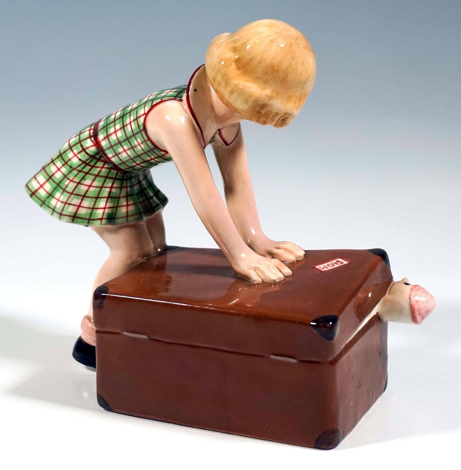 Goldscheider Vienna Figurine, Little Girl Closing A Suitcase, By Dakon, Ca. 1937 photo for sale