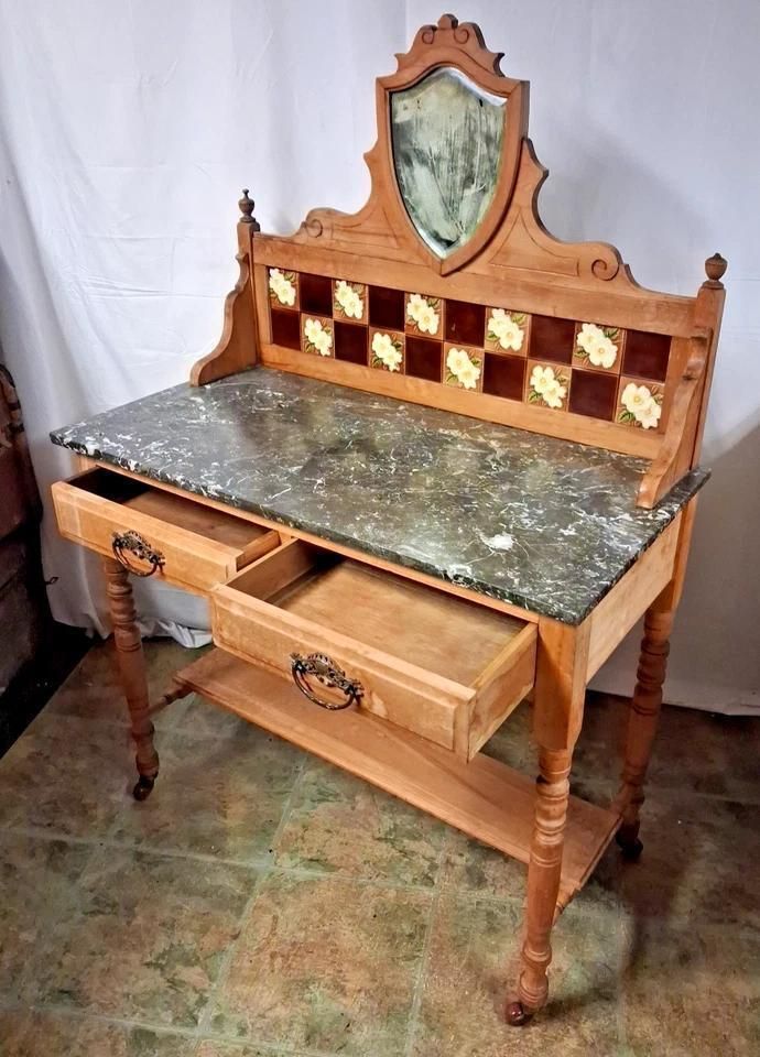 photo furniture Antique Wash Stand With Marble Top And A Tarnished Mirror On Castors