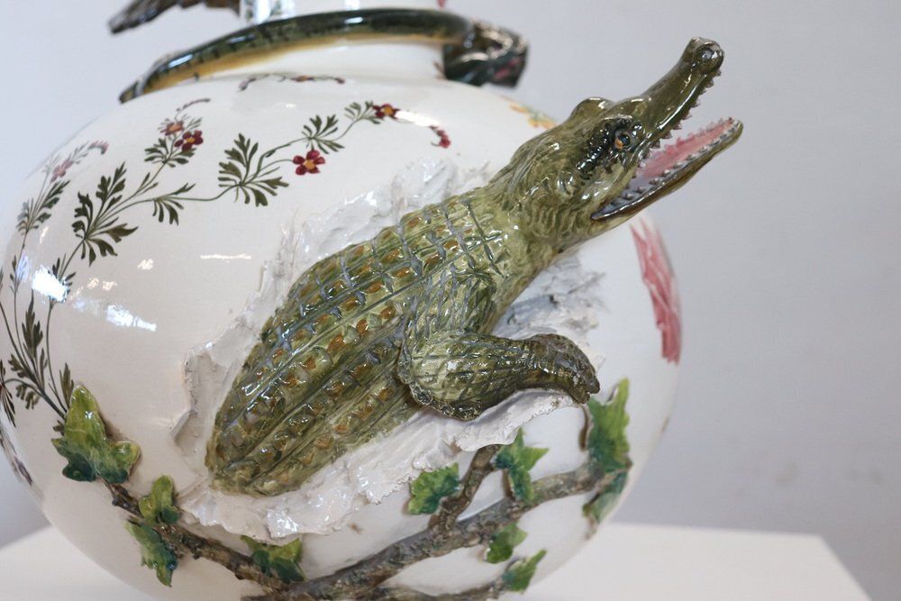 photo vintage Ceramic Vase With Relief Figures Of Eagle And Crocodile, Early 20th Century