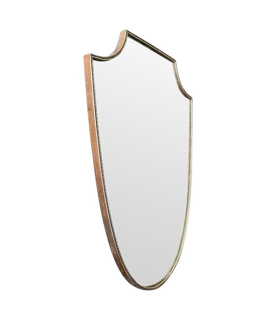 An Orignal Italian 1960s Brass Shield Mirror With Beaded Inner Frame Detail photo furniture